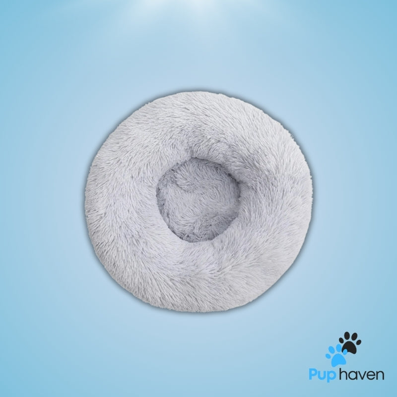 Light Grey Cozy plush round pet bed for dogs and cats, offering warmth and ultimate comfort.