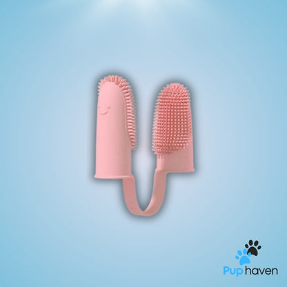 Pink Pet two-finger toothbrush for dogs and cats, designed for easy and effective dental care.