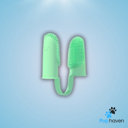 Plum Pet two-finger toothbrush for dogs and cats, designed for easy and effective dental care.